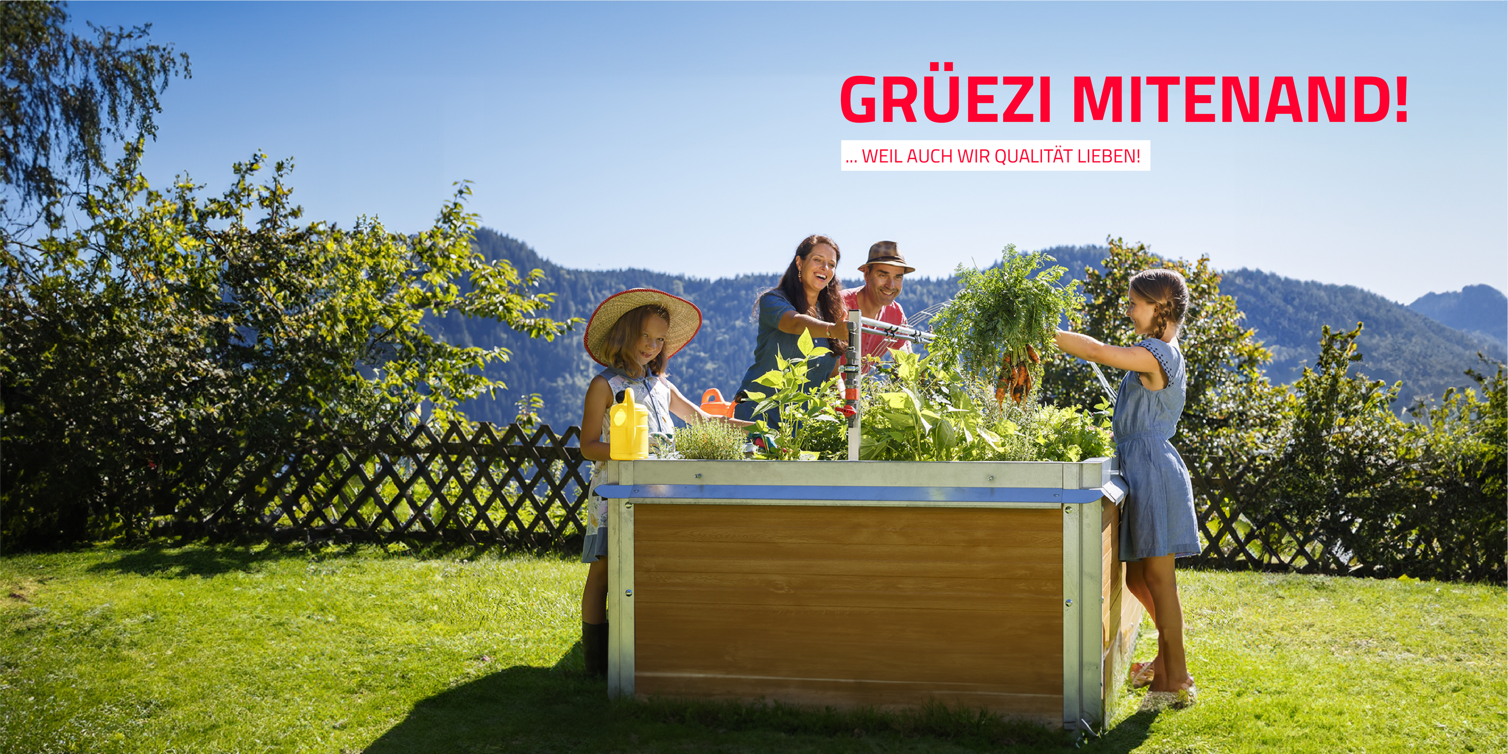 Familie bei der Arbeit am Hochbeet im Garten